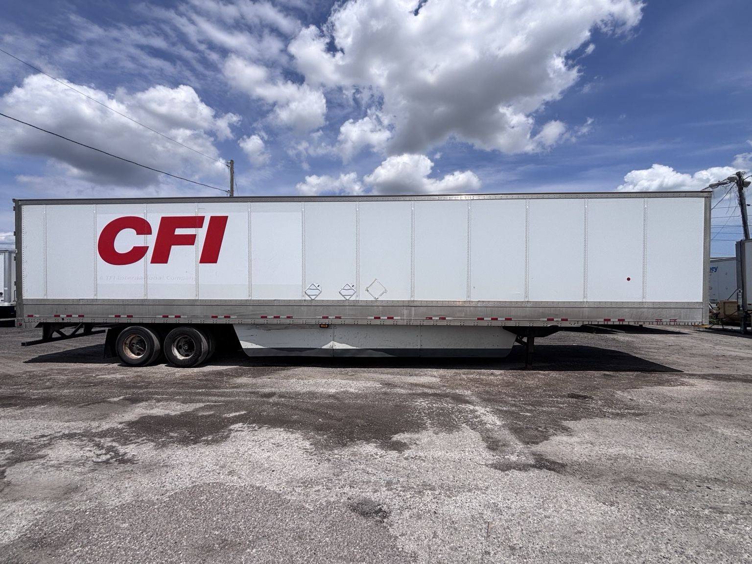 Commercial semi-trailer parked in an industrial fleet yard