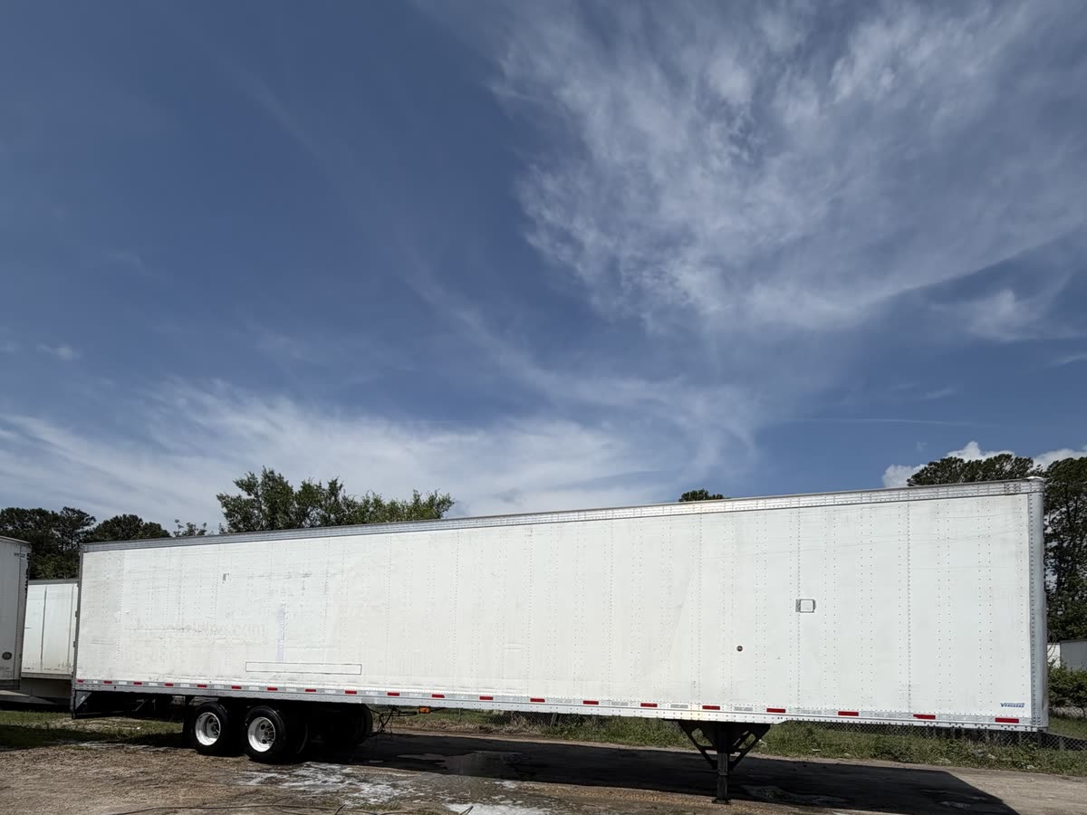 The same 53-foot semi-trailer after washing and aluminum brightening, with bright white panels and polished trim
