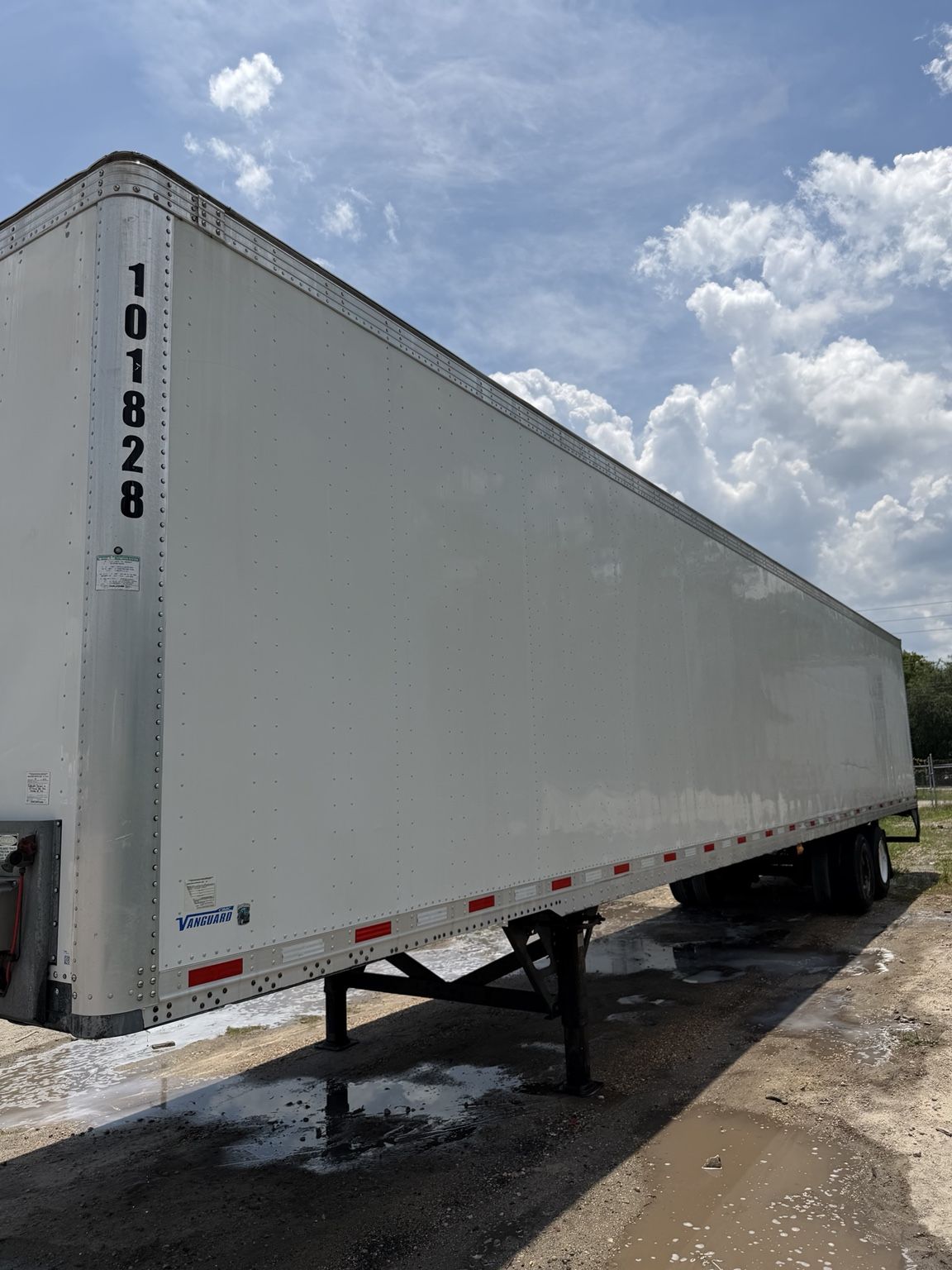 Commercial trailer being washed and restored by a professional crew